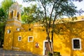 Old Mexican Church surrounded by trees in Coyoacan