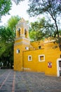 Old Mexican Church surrounded by trees in Coyoacan