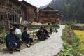Old Miao men chatting in Langde Miao village, Guizhou province, China