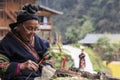 Old Miao woman weaving in Langde Miao village, Guizhou province, China
