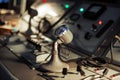 Old microphone, vintage mixer console in the recording room, command center Royalty Free Stock Photo