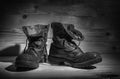 Old military boots in black and white. Royalty Free Stock Photo