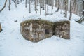 Old military bunker from WWII in winter forest. Located in Czech republic, Krkonose. Royalty Free Stock Photo