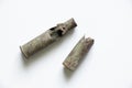 old military cartridges buried in the ground on a white background, cartridges of the second world stinking close-up Royalty Free Stock Photo