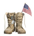 Old military combat boots with the American flag and dog tags Royalty Free Stock Photo