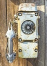 Old military phone on a wooden wall. Royalty Free Stock Photo