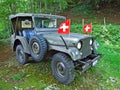 Old military terrain car in the alpine forest of Alpstein mountain range