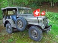 Old military terrain car in the alpine forest of Alpstein mountain range Royalty Free Stock Photo