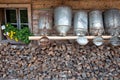 Old milk cans at a alpine hut Royalty Free Stock Photo