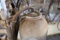 Old milk collection flask seen in an abandoned milking parlour. Royalty Free Stock Photo