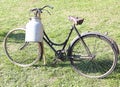 old milking bicycle and aluminum milk canister Royalty Free Stock Photo