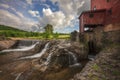 Old Mill along river and waterfall Royalty Free Stock Photo