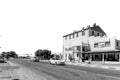 Old mill building, people, vehicles in Kakamas. Monochrome