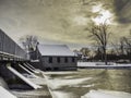 Old Mill at the dam in winter Royalty Free Stock Photo