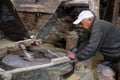 Old mill for grinding grain up close. The miller grinds grain