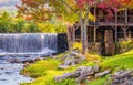 Old Mill Museum, water wheel, millpond and waterfall in historic Weston Village Royalty Free Stock Photo