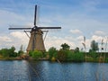 Old mill near a water canal at Kinderdijk Overwaard in the Netherlands. Windmill Unesco World Heritage with unique Dutch sight as