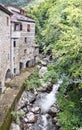 Old mill and stream. Times gone by. Picturesque stone buildings. Royalty Free Stock Photo