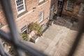 Old mill warehouse red brick courtyard with bench