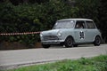 Old Mini Cooper car racing on the road. Royalty Free Stock Photo