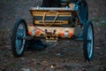 Old mini wagon, on wheels for a bicycle Royalty Free Stock Photo