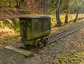 Old mining cart on tracks in open air museum by Stribro