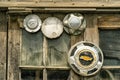 Old mixed hubcaps in a window