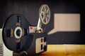 Old 8mm Film Projector over wooden table and textured background Royalty Free Stock Photo