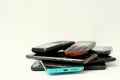 old mobile phones piled up on a table with no people stock image stock photo Royalty Free Stock Photo