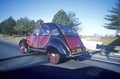 An old model Citroen on the road