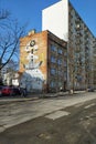 Old modernistic house with mural on and new block of flats in Gdynia, Poland.