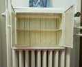 Metal cabinet on the radiator.