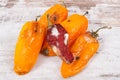 Old, moldy and wrinkled peppers. Unhealthy, decompose, spoiled vegetable