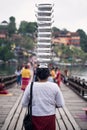 pots on woman head at Mon wood bridge, Sangkhlaburi Royalty Free Stock Photo