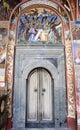 Old monastery door bible murals Royalty Free Stock Photo