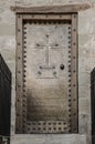 Old monastery door with metal decor Royalty Free Stock Photo