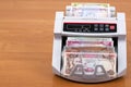Old money from Afghanistan in a counting machine Royalty Free Stock Photo
