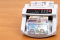Old money from Madagascar in a counting machine Royalty Free Stock Photo