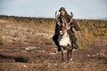 Old Mongolian man riding a reindeer. Royalty Free Stock Photo