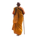 Old monk holding a walking stick Royalty Free Stock Photo