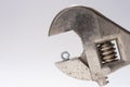 Old monkey wrench and little bolt nut Royalty Free Stock Photo