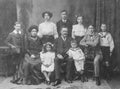 Old monochrome studio photograph of a large Edwardian family. Photographed in Glasgow, Scotland, circa 1906. Royalty Free Stock Photo