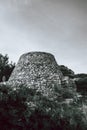 Old monumental castle ruin black and white-shot with beautiful orange sky in Puglia, Italy