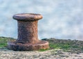 Old Mooring Bollard on the harbor Royalty Free Stock Photo