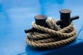 Old mooring bollard with heavy ropes Royalty Free Stock Photo