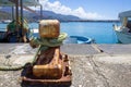 Old Mooring Bollard with rope Tied on Pier. Boat Tied With a Rope on a Mooring Royalty Free Stock Photo