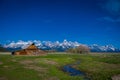 Old mormon barn in Grand Teton Mountains with low clouds. Grand Teton National Park, Wyoming