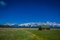 Old mormon barn in Grand Teton Mountains with low clouds. Grand Teton National Park, Wyoming Royalty Free Stock Photo