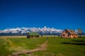 Old mormon barn in Grand Teton Mountains with low clouds. Grand Teton National Park, Wyoming