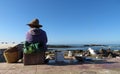 An old Moroccan fisherman looking into the sea